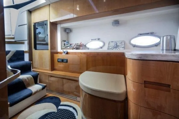 Chopin Yacht Photos Pics Luxurious interior of a 2007 Pershing 62' yacht with modern wood finishes and stylish decor.