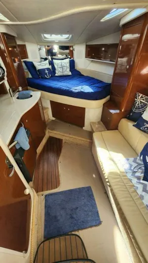 Back In The Game Yacht Photos Pics Interior of 2008 Sea Ray 310 Sundancer with cozy cabin and nautical decor.