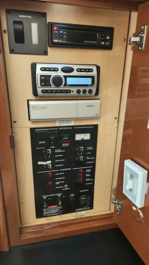 Back In The Game Yacht Photos Pics Control panel of 2008 Sea Ray 310 Sundancer boat with audio and electrical systems.