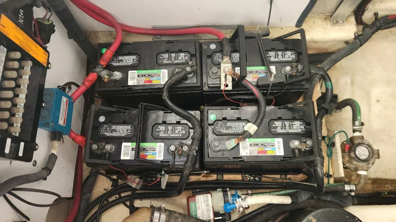 Back In The Game Yacht Photos Pics Battery compartment of 2008 Sea Ray 310 Sundancer with multiple connected batteries.