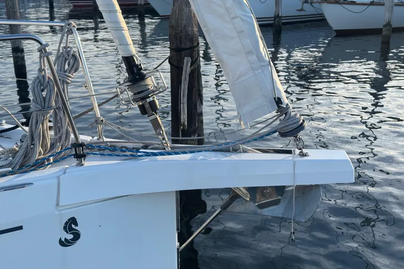 Sway Yacht Photos Pics 2023 Beneteau Oceanis 40.1 sailboat bow with ropes and anchor in marina.