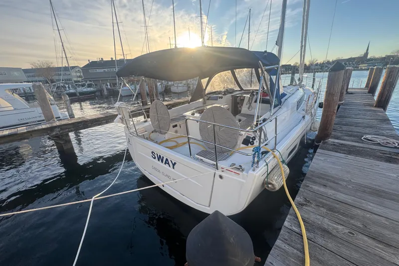Sway Yacht Photos Pics 2023 Beneteau Oceanis 40.1 sailboat docked at marina during sunset.