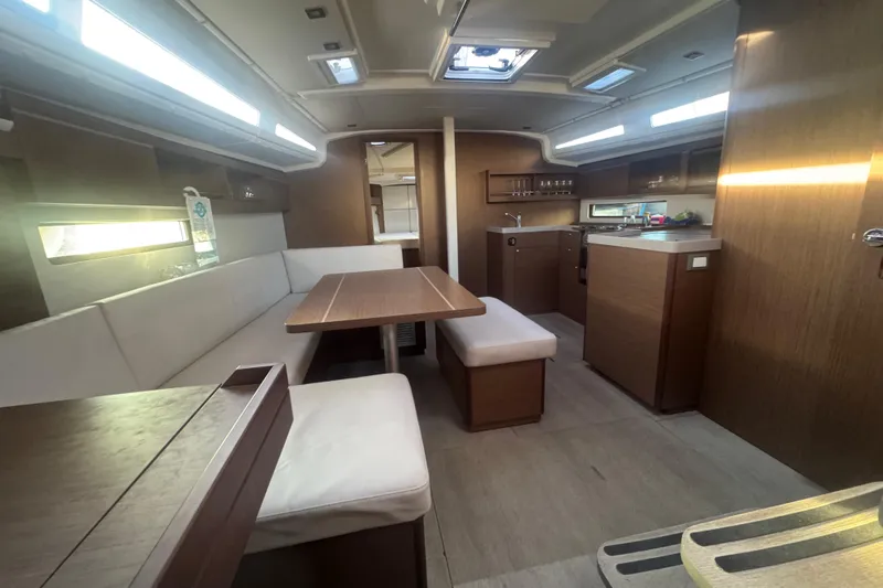 Sway Yacht Photos Pics Interior of 2023 Beneteau Oceanis 40.1 yacht, featuring modern dining and kitchen area.