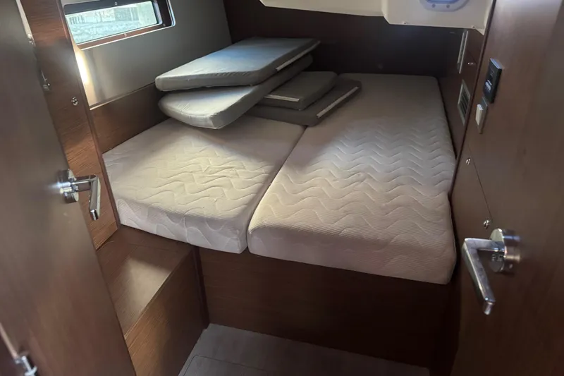 Sway Yacht Photos Pics 2023 Beneteau Oceanis 40.1 cabin interior with neatly arranged mattresses.
