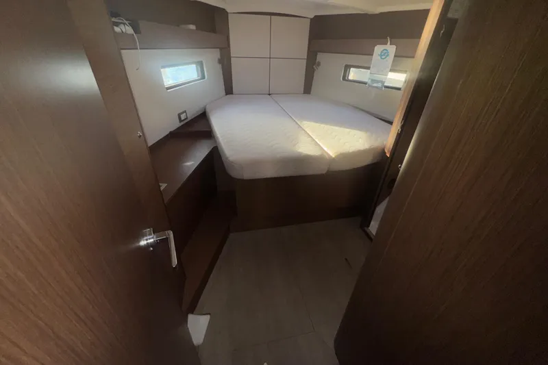 Sway Yacht Photos Pics 2023 Beneteau Oceanis 40.1 cabin interior with bed and wooden furnishings.