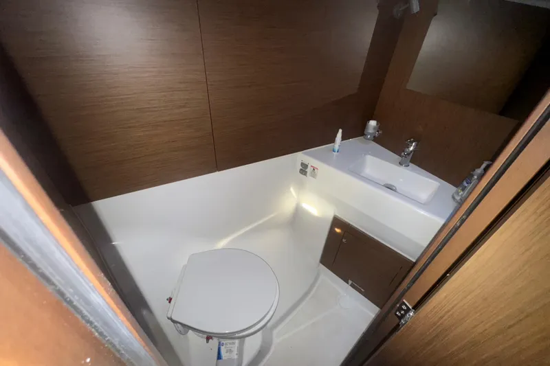 Sway Yacht Photos Pics 2023 Beneteau Oceanis 40.1 yacht bathroom with modern fixtures and wooden accents.