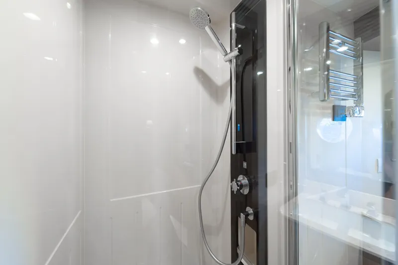 Izi Yacht Photos Pics Shower area in 2017 Azimut Magellano 66 yacht, featuring modern fixtures and sleek design.