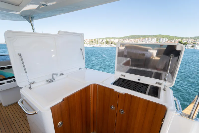 Izi Yacht Photos Pics Outdoor kitchen on 2017 Azimut Magellano 66 yacht with sink and grill.