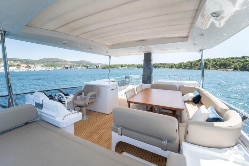 Izi Yacht Photos Pics Luxurious 2017 Azimut Magellano 66 yacht deck with seating and ocean view.