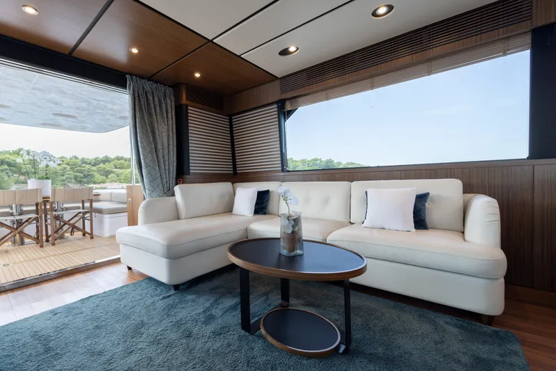 Izi Yacht Photos Pics Luxurious interior of 2017 Azimut Magellano 66 yacht with elegant seating and scenic views.