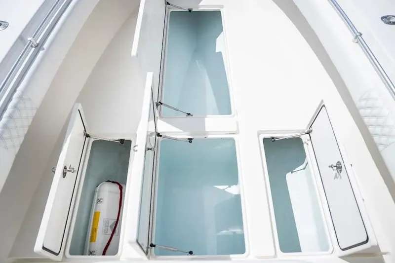  Yacht Photos Pics 2013 Contender 35 ST boat storage compartments with open hatches, showcasing interior space.