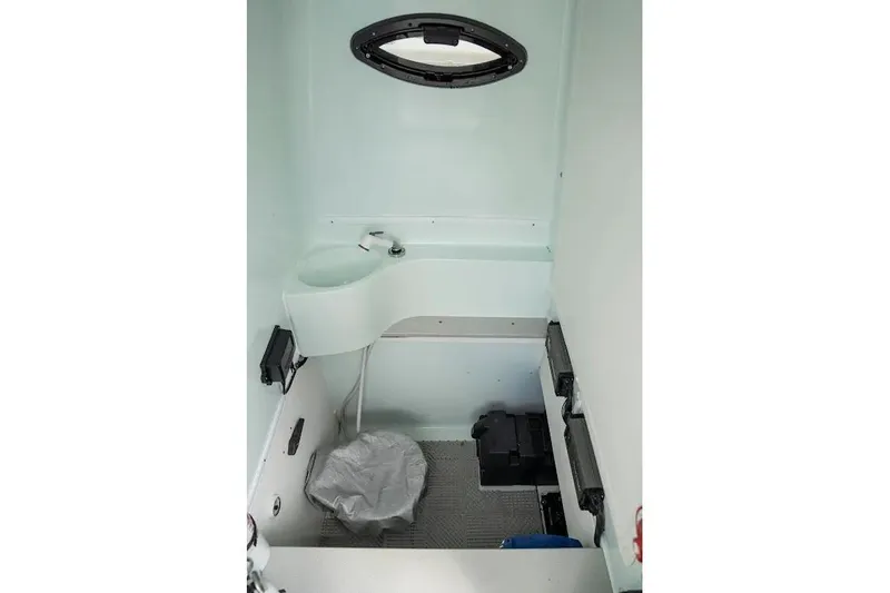  Yacht Photos Pics 2013 Contender 35 ST boat interior with compact sink and toilet.