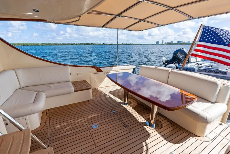 Tutto Bene Yacht Photos Pics Luxurious 2018 Palm Beach Motor Yachts PB55 Flybridge with elegant seating and ocean view.