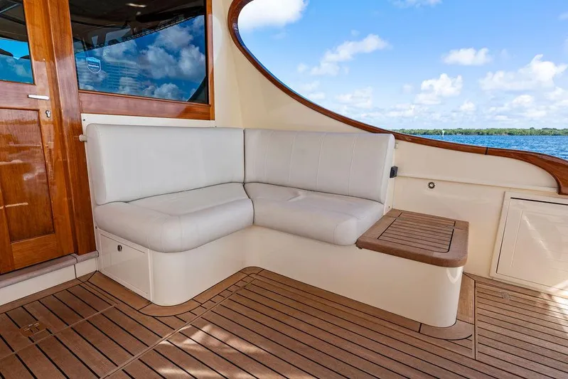 Tutto Bene Yacht Photos Pics Luxurious seating area on 2018 Palm Beach Motor Yachts PB55 Flybridge with ocean view.