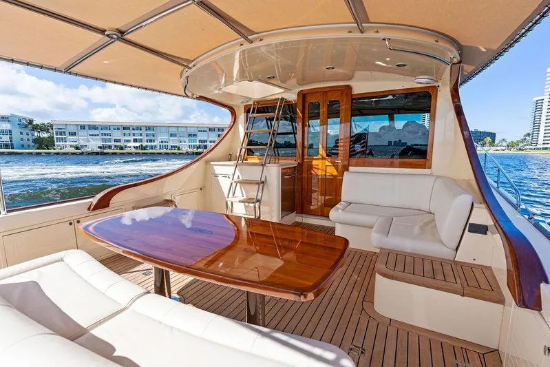 Tutto Bene Yacht Photos Pics 2018 Palm Beach Motor Yachts PB55 Flybridge with elegant teak deck and luxurious seating.