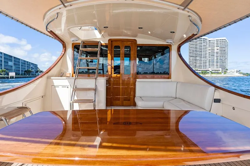 Tutto Bene Yacht Photos Pics Luxurious 2018 Palm Beach Motor Yachts PB55 Flybridge with elegant wood table and waterfront view.