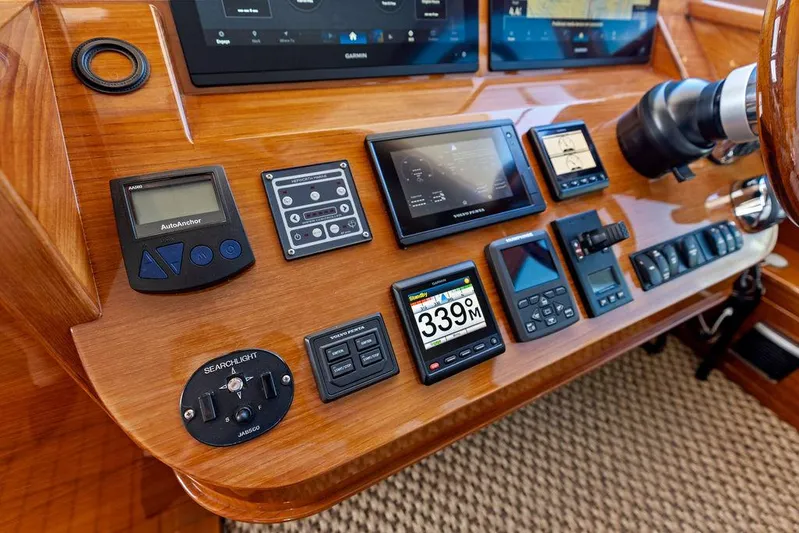Tutto Bene Yacht Photos Pics Control panel of 2018 Palm Beach Motor Yachts PB55 Flybridge with navigation instruments.