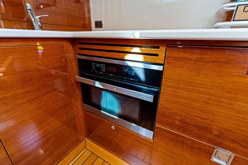 Tutto Bene Yacht Photos Pics Modern kitchen in 2018 Palm Beach Motor Yachts PB55 Flybridge with built-in oven.