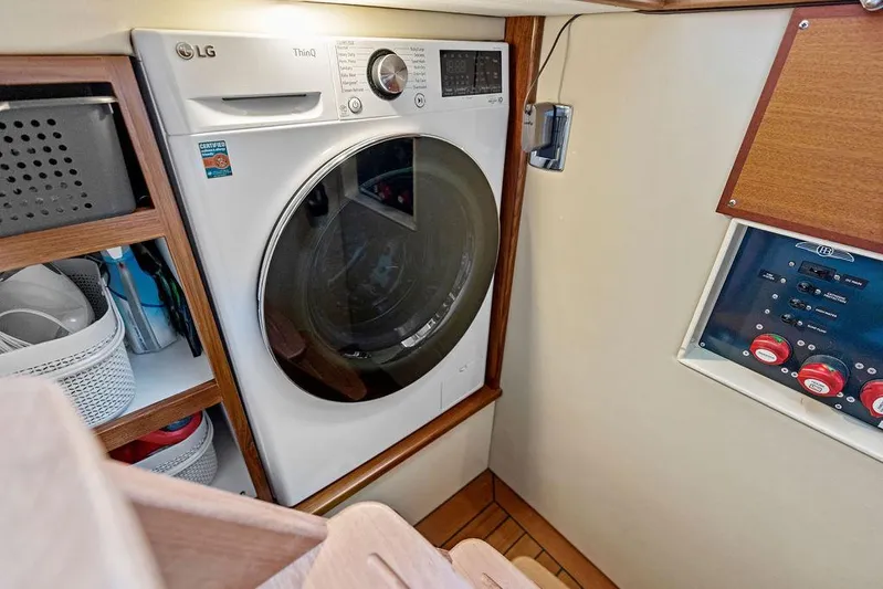 Tutto Bene Yacht Photos Pics Laundry area in 2018 Palm Beach Motor Yachts PB55 Flybridge with LG washer.