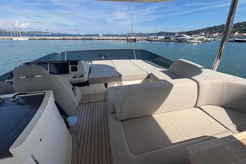  Yacht Photos Pics Luxurious 2023 Absolute 60 Fly yacht interior with spacious seating and scenic marina view.