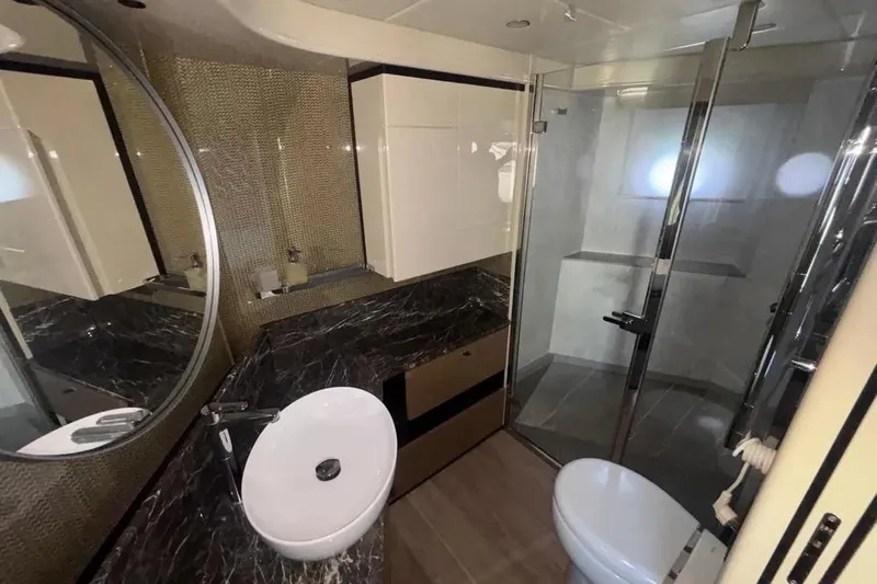  Yacht Photos Pics Luxurious bathroom in 2023 Absolute 60 Fly yacht with modern fixtures and elegant design.