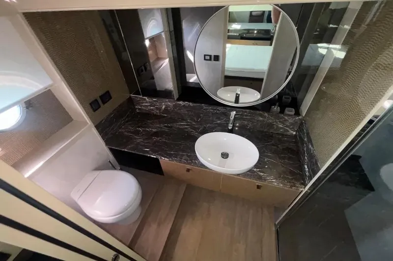  Yacht Photos Pics Luxurious bathroom in 2023 Absolute 60 Fly yacht with modern fixtures and elegant design.