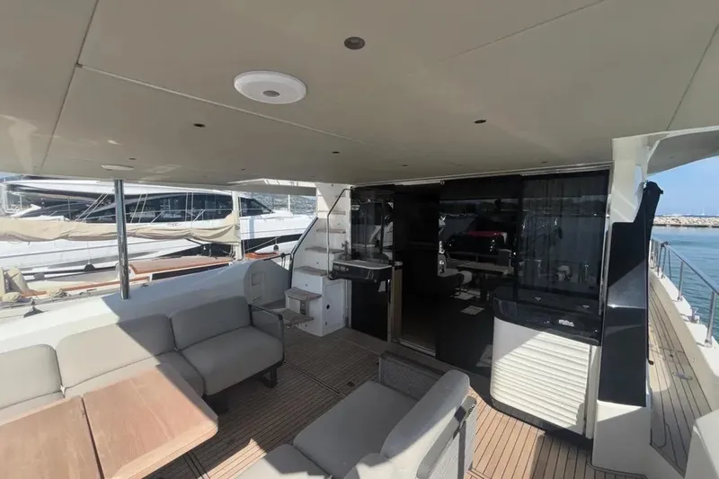  Yacht Photos Pics Luxurious 2023 Absolute 60 Fly yacht deck with modern seating and sleek design.