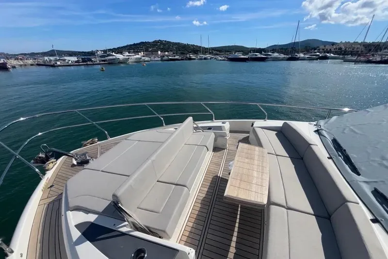  Yacht Photos Pics Luxurious 2023 Absolute 60 Fly yacht with spacious deck and scenic marina view.