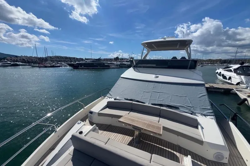  Yacht Photos Pics Luxury Absolute 60 Fly yacht docked in marina, 2023 model, under clear blue sky.