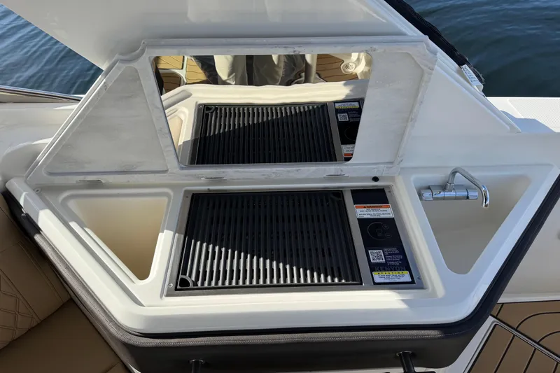  Yacht Photos Pics Outdoor grill and sink on 2026 Sea Ray SLX 310 boat, featuring modern design.