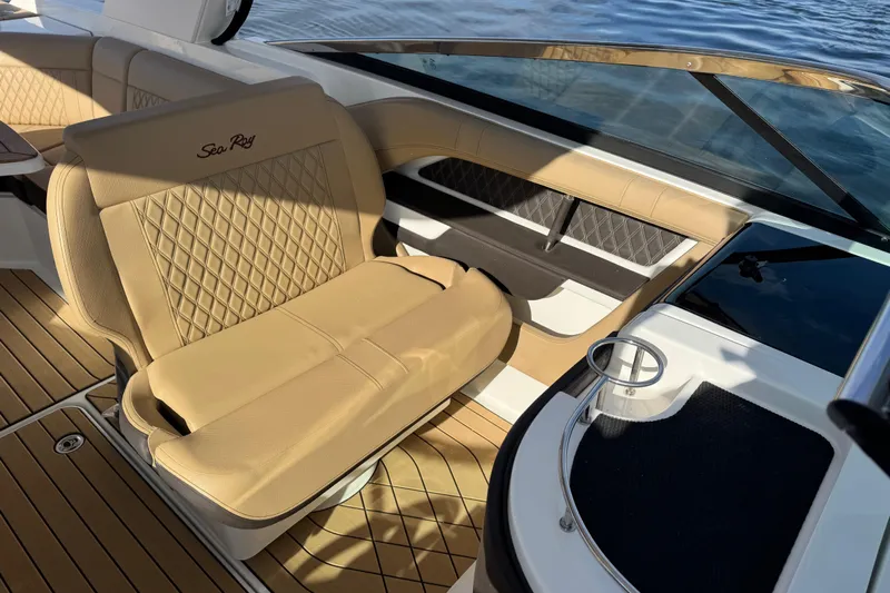 Yacht Photos Pics 2026 Sea Ray SLX 310 boat interior with tan leather seating and elegant design.