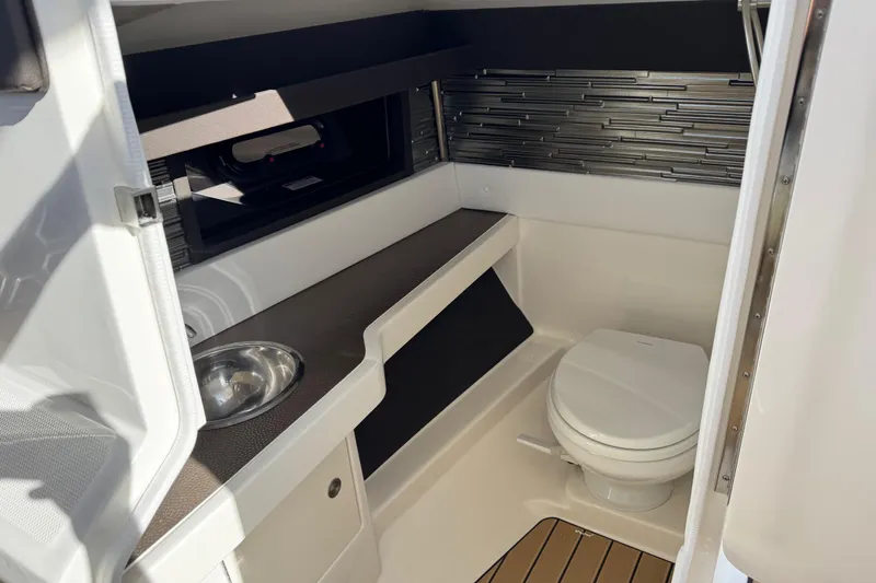  Yacht Photos Pics 2026 Sea Ray SLX 310 boat interior with modern bathroom amenities.