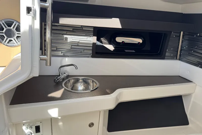  Yacht Photos Pics 2026 Sea Ray SLX 310 boat interior with sink and modern design elements.