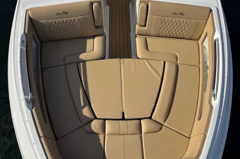  Yacht Photos Pics Luxurious seating on 2026 Sea Ray SLX 310 boat, featuring tan upholstery and elegant design.