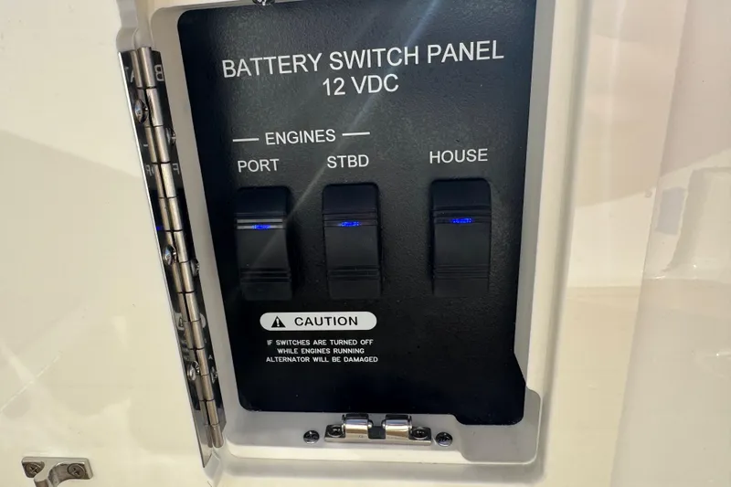  Yacht Photos Pics Battery switch panel on 2026 Sea Ray SLX 310 boat, featuring engine and house controls.