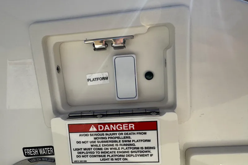  Yacht Photos Pics Control panel on 2026 Sea Ray SLX 310 boat with safety warning labels.