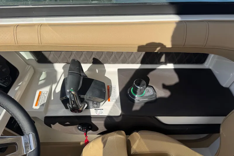  Yacht Photos Pics 2026 Sea Ray SLX 310 helm with modern controls and luxurious tan upholstery.