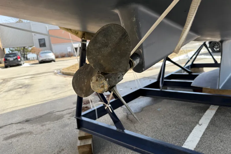 Quest Yacht Photos Pics Catalina 350 sailboat propeller on trailer, 2004 model, in a parking lot.