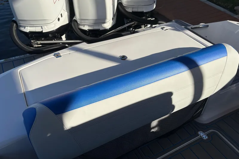 Yacht Photos Pics 2023 Nor-Tech 390 Sport Center Console with blue and white seating, featuring powerful outboard engines.