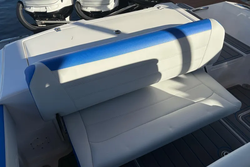 Yacht Photos Pics 2023 Nor-Tech 390 Sport Center Console boat seat with blue and white upholstery.