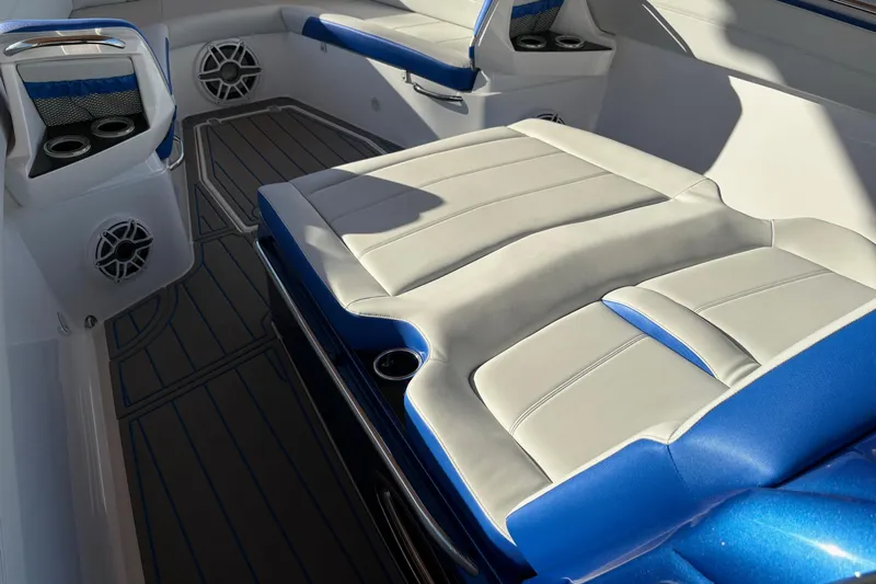  Yacht Photos Pics 2023 Nor-Tech 390 Sport Center Console interior with blue and white seating and cup holders.
