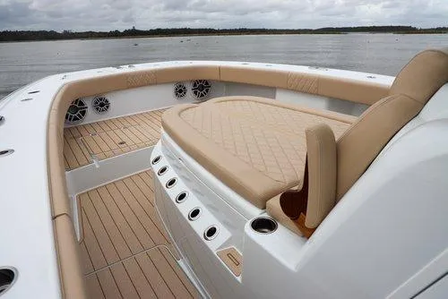  Yacht Photos Pics Luxurious 2026 Freeman 38 boat interior with beige seating and wood flooring.
