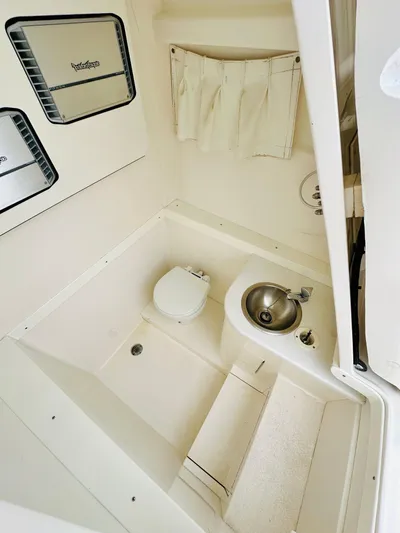  Yacht Photos Pics 2004 Intrepid 370 Open boat bathroom with toilet and sink.