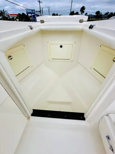  Yacht Photos Pics 2004 Intrepid 370 Open boat interior with storage compartments.
