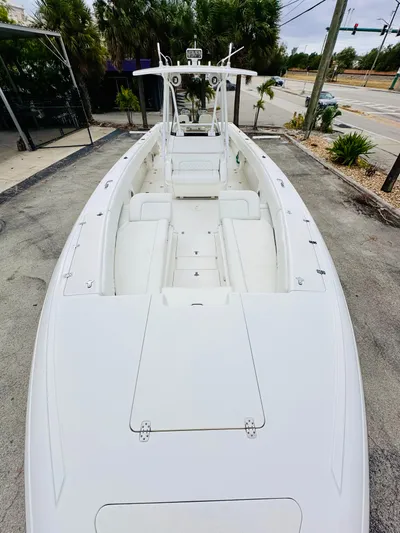  Yacht Photos Pics 2004 Intrepid 370 Open boat, white exterior, docked on a concrete surface.