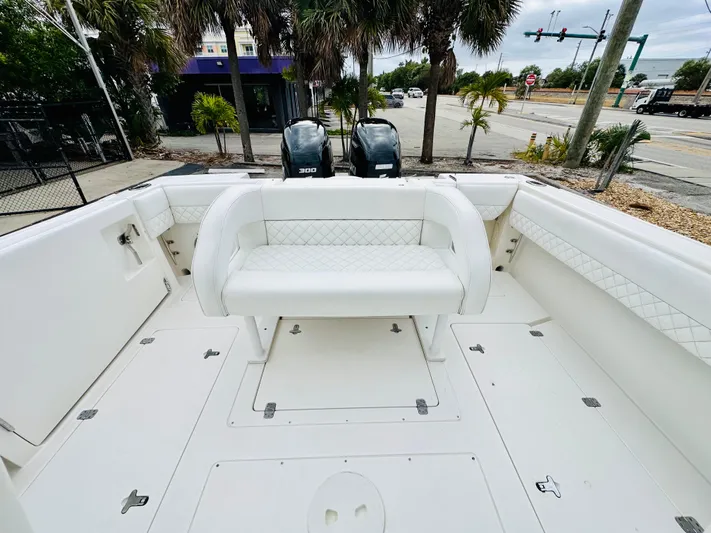  Yacht Photos Pics 2004 Intrepid 370 Open boat interior with seating and dual engines.