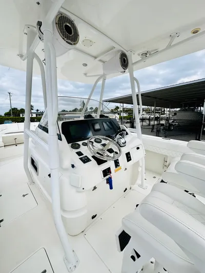  Yacht Photos Pics 2004 Intrepid 370 Open boat cockpit with modern controls and seating.