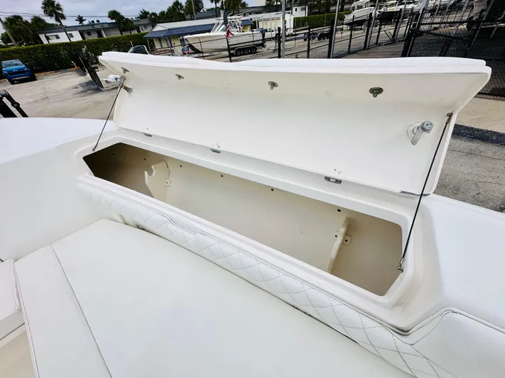  Yacht Photos Pics Open storage compartment on 2004 Intrepid 370 Open boat, dockside view.