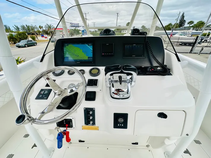  Yacht Photos Pics 2004 Intrepid 370 Open boat helm with navigation screens and controls.