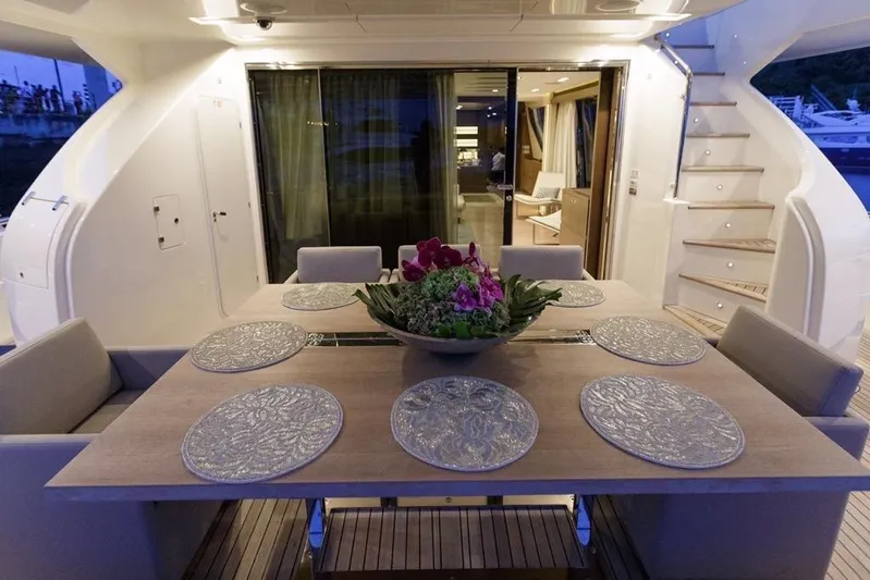Sha Sha Sha IV Yacht Photos Pics Luxurious yacht dining area with elegant table setting, Custom Line 100, 2014 model.